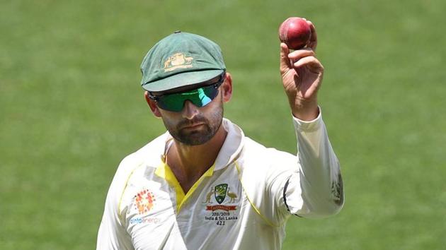 Australia's Nathan Lyon shows the ball as he leaves the field following his 6 wicket haul on day four of the first test match between Australia and India at the Adelaide Oval in Adelaide. (REUTERS) Australia's Nathan Lyon shows the ball as he leaves the field following his 6 wicket haul on day four of the first test match between Australia and India at the Adelaide Oval in Adelaide. (REUTERS)