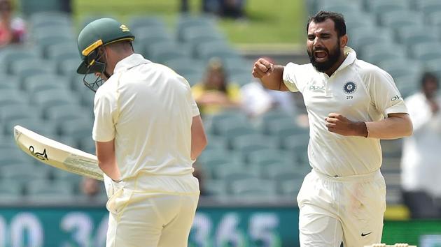 India's fast bowler Mohammed Shami (R) celebrates dismissing Australia's Marcus Harris (L). (AFP)