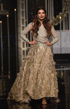 A model presents a creation by designer Nilofer Shahid during the Pantene Hum Bridal Couture Week in Lahore. (AFP) A model presents a creation by designer Nilofer Shahid during the Pantene Hum Bridal Couture Week in Lahore. (AFP)