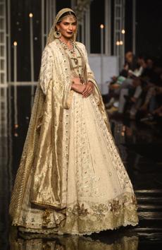 A model presents a creation by designer Nilofer Shahid during the Pantene Hum Bridal Couture Week in Lahore.. (AFP) A model presents a creation by designer Nilofer Shahid during the Pantene Hum Bridal Couture Week in Lahore.. (AFP)