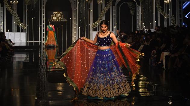 A model presents a creation by designer Nilofer Shahid during the Pantene Hum Bridal Couture Week in Lahore on December 7, 2018. (AFP) A model presents a creation by designer Nilofer Shahid during the Pantene Hum Bridal Couture Week in Lahore on December 7, 2018. (AFP)