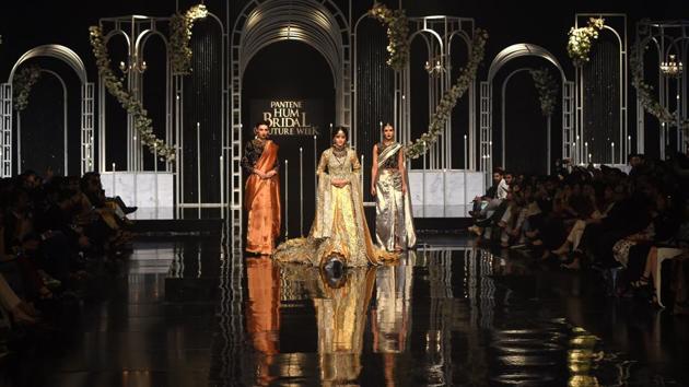 Models present creations by designer Nilofer Shahid during the Pantene Hum Bridal Couture Week in Lahore. (AFP) Models present creations by designer Nilofer Shahid during the Pantene Hum Bridal Couture Week in Lahore. (AFP)