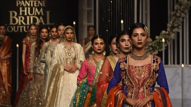 Models present creations by designer Nilofer Shahid during the Pantene Hum Bridal Couture Week in Lahore on December 7, 2018. (AFP) Models present creations by designer Nilofer Shahid during the Pantene Hum Bridal Couture Week in Lahore on December 7, 2018. (AFP)