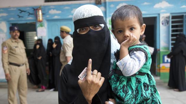 Telangana assembly elections 2018: An Indian woman shows the indelible ink mark on her index fingers after casting her vote in Hyderabad, India, Friday, Dec. 7, 2018. This is the first state elections in Telangana after it was formed bifurcating Indian state of Andhra Pradesh.(AP file photo)