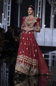 A model presents a creation by designer Tabassum Mughal during Bridal Couture Week, in Lahore, Pakistan. (AP) A model presents a creation by designer Tabassum Mughal during Bridal Couture Week, in Lahore, Pakistan. (AP)