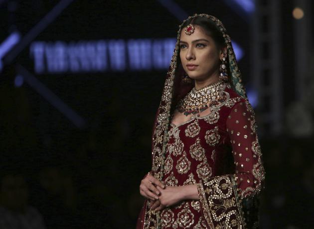 A model presents a creation by designer Tabassum Mughal during Bridal Couture Week, in Lahore, Pakistan. (AP) A model presents a creation by designer Tabassum Mughal during Bridal Couture Week, in Lahore, Pakistan. (AP)