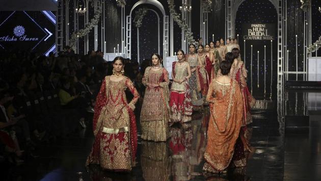 Models present the creations by designer Aisha Imran during Bridal Couture Week, in Lahore, Pakistan. (AP) Models present the creations by designer Aisha Imran during Bridal Couture Week, in Lahore, Pakistan. (AP)