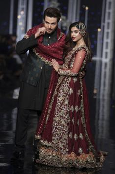 Models present the creation by designer Tabassum Mughal during Bridal Couture Week, in Lahore, Pakistan. (AP) Models present the creation by designer Tabassum Mughal during Bridal Couture Week, in Lahore, Pakistan. (AP)