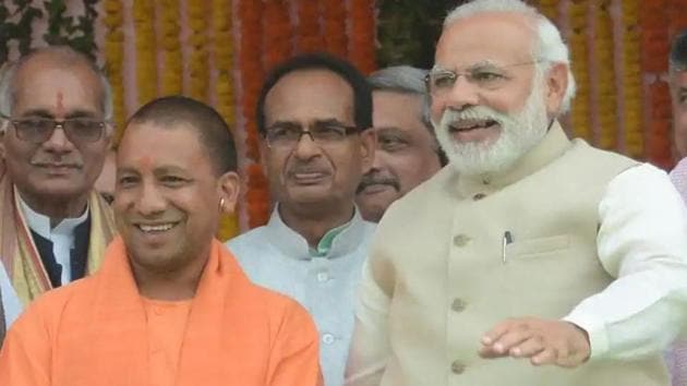 PM Modi and Yogi Adityanath as he was sworn-in as the Uttar Pradesh Chief minister(HT File Photo)