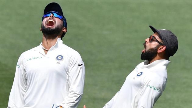 India's wicketkeeper Rishabh Pant (L) and captain Virat Kohli celebrate the fall of a wicket during Adelaide Test.(REUTERS)