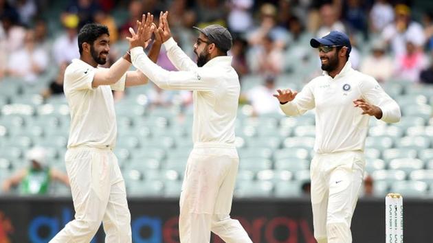 India's Jasprit Bumrah celebrates with captain Virat Kohli after dismissing Australia's captain Tim Paine. (REUTERS) India's Jasprit Bumrah celebrates with captain Virat Kohli after dismissing Australia's captain Tim Paine. (REUTERS)