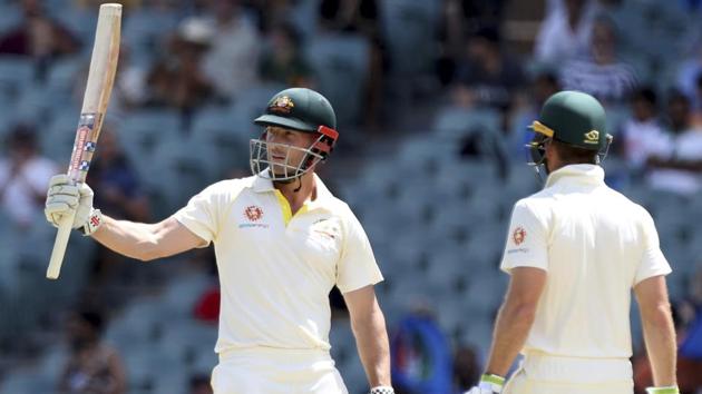 Australia's Shaun Marsh gestures with his bat after scoring a half century. (AP)