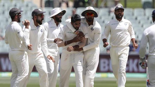 India's Jasprit Bumrah is congratulated by teammates after dismissing Australia's Shaun Marsh during the first cricket test between Australia and India in Adelaide.(AP)