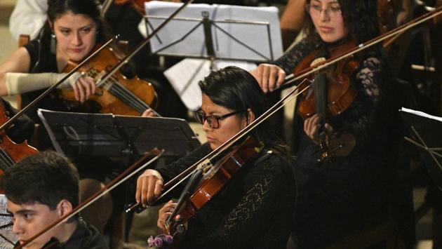 A fan of German Baroque composer Georg Philipp Telemann -- but also Vivaldi, Mozart and Bach -- Chura dreams of playing in a symphony orchestra like Venezuela’s Simon Bolivar Symphony Orchestra. She is not alone --many of the 80 or so children and young adults in the Chulumani Symphony hope their love of music can turn into a lifelong occupation. (Aizar Raldes / AFP) 