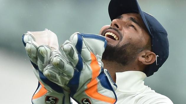 India's wicket-keeper Rishabh Pant celebrates catching Australia's batsman Josh Hazlewood.(AFP)