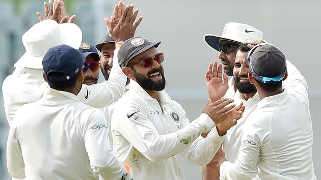 India's captain Virat Kohli (C) celebrates the wicket of Australia's Peter Handscomb. (AFP)