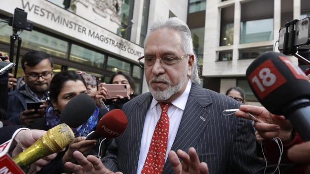 Businessman Vijay Mallya is surrounded by the media as he leaves Westminster Magistrates Court in London, Monday, Dec. 10, 2018. A British court has ordered that charismatic Indian tycoon Vijay Mallya should face extradition to India on financial fraud allegations.(AP Photo)