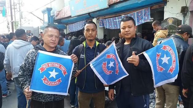 Mizo National Front supporters outside the party office in Aizawl as the party raced ahead in the Mizoram assembly elections (HT Photo)(HT)