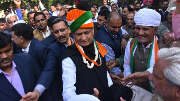 Congress leader and former chief minister Ashok Gehlot with supporters in Jaipur on Tuesday as trends showed the party leading in the assembly election results.(HT photo)