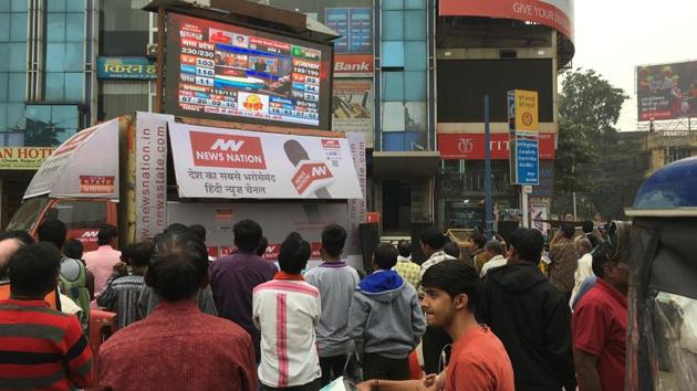 People watch assembly election results live streaming on a roadside at Jaistambh Chowk, in Raipur, Chattisgarh. The Congress has pulled way ahead, leading in 68 of the state’s 90 seats, a gain of 29 seats from last time. A party needs 46 to form government in the state, ruled by the BJP for the last 15 years. The BJP claimed 15 seats. (Arijit Sen / HT Photo) People watch assembly election results live streaming on a roadside at Jaistambh Chowk, in Raipur, Chattisgarh. The Congress has pulled way ahead, leading in 68 of the state’s 90 seats, a gain of 29 seats from last time. A party needs 46 to form government in the state, ruled by the BJP for the last 15 years. The BJP claimed 15 seats. (Arijit Sen / HT Photo)