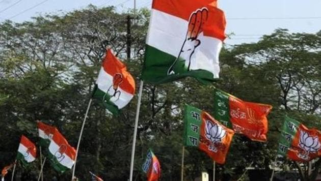 Congress and BJP supporters wave flags.(File Photo by Arun Mondhe/ Hindustan Times)