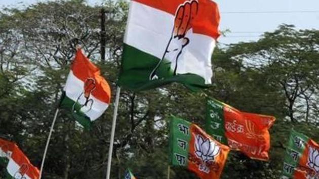 File image - Congress and BJP supporters wave flags in a show of strength. (Hindustan Times) File image - Congress and BJP supporters wave flags in a show of strength. (Hindustan Times)