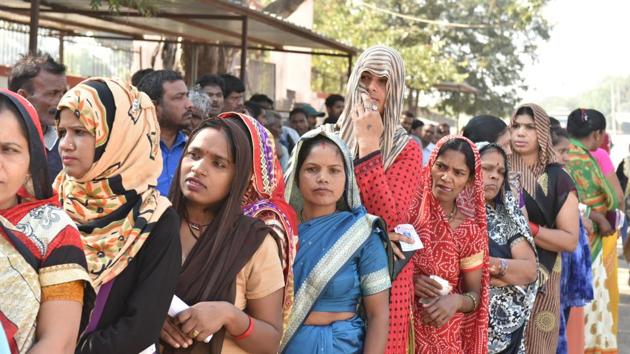 Voters stand in a queue to cast their votes, at North TT Nagar, in Bhopal, India, on Wednesday, November 28, 2018.(Mujeeb Faruqui/HT Photo)