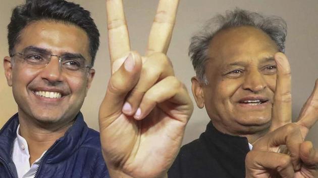Congress leaders Ashok Gehlot (R) and Sachin Pilot (C) flash victory signs after the declaration of Rajasthan Assembly election result, in Jaipur, Tuesday, December 11, 2018.(PTI)