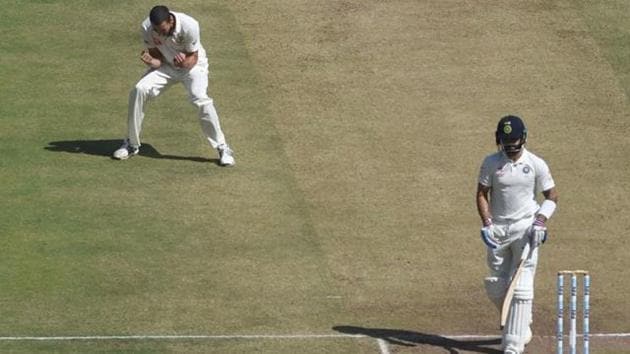 Australia's Mitchell Starc (L) celebrates after the dismissal of India's captain Virat Kohli during the second day of the first cricket Test match between India and Australia at The Maharashtra Cricket Association Stadium in Pune.(AFP) Australia's Mitchell Starc (L) celebrates after the dismissal of India's captain Virat Kohli during the second day of the first cricket Test match between India and Australia at The Maharashtra Cricket Association Stadium in Pune.(AFP)