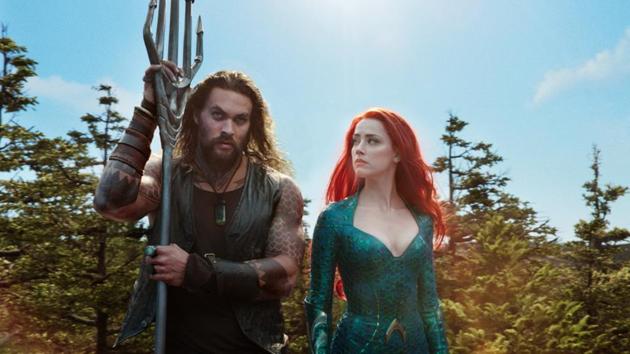 This image released by Warner Bros. Pictures shows Jason Momoa, left, and Amber Heard in a scene from Aquaman.(AP)