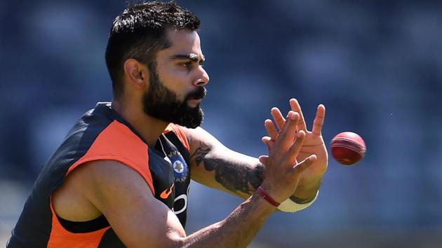 India's cricket captain Virat Kohli takes a catch during a training session in Perth on December 12, 2018. - India take on Australia in the second cricket Test match starting on 14 December in Perth.(AFP) India's cricket captain Virat Kohli takes a catch during a training session in Perth on December 12, 2018. - India take on Australia in the second cricket Test match starting on 14 December in Perth.(AFP)