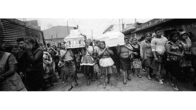 Residents walk towards the cemetery carrying coffins that contain the remains of residents who died in the Volcano of Fire eruption, in San Juan Alotenango, Guatemala. The explosion devastated entire families living in tightly knit communities on the mountain’s flanks. (Rodrigo Abd / AP) Residents walk towards the cemetery carrying coffins that contain the remains of residents who died in the Volcano of Fire eruption, in San Juan Alotenango, Guatemala. The explosion devastated entire families living in tightly knit communities on the mountain’s flanks. (Rodrigo Abd / AP)