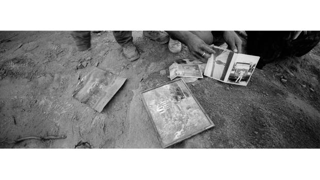 Residents look through family photos found outside a home. Two days after the eruption, the terrain was still too hot in many places for rescue crews to search for bodies. Six months after what is now being called “The Colossus,” relatives still seek missing family members by their own means. Government and relief agencies have ended their search for the dead. (Rodrigo Abd / AP) Residents look through family photos found outside a home. Two days after the eruption, the terrain was still too hot in many places for rescue crews to search for bodies. Six months after what is now being called “The Colossus,” relatives still seek missing family members by their own means. Government and relief agencies have ended their search for the dead. (Rodrigo Abd / AP)