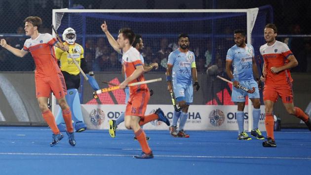 Netherlands players, in orange, celebrate scoring a goal during the Men's Hockey World Cup quarterfinal match between India and Netherlands at Kalinga Stadium in Bhubaneswar. (AP) Netherlands players, in orange, celebrate scoring a goal during the Men's Hockey World Cup quarterfinal match between India and Netherlands at Kalinga Stadium in Bhubaneswar. (AP)