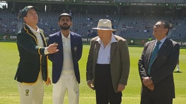 Tim Paine tosses the coin in air as Virat Kohli looks on. (BCCI/ Twitter) Tim Paine tosses the coin in air as Virat Kohli looks on. (BCCI/ Twitter)