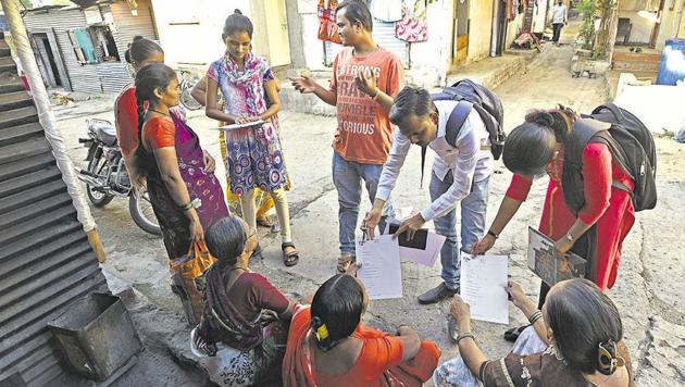 Interns of NGO Samyak on a field visit in Tukai Nagar on Wednesday.(Pratham Gokhale/HT Photo)