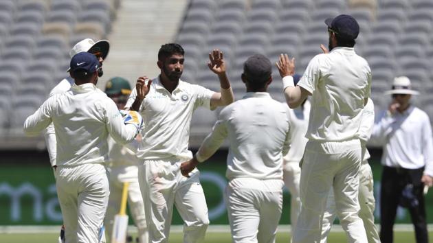 India's Jasprit Bumrah (center) celebrates taking the wicket of Australia's Aaron Finch during play in the second cricket test between Australia and India in Perth. (AP)