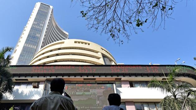Men look up at an electronic ticker board that indicates stock figures at Bombay Stock Exchange in Mumbai, Maharashtra. (Satyabrata Tripathy / HT Photo) Men look up at an electronic ticker board that indicates stock figures at Bombay Stock Exchange in Mumbai, Maharashtra. (Satyabrata Tripathy / HT Photo)