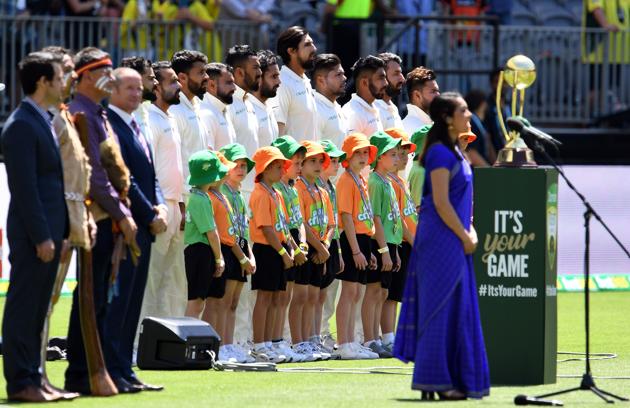 Indian cricketers sing the national anthem before the start of day one of the second Test match between Australia and India in Perth. (AFP) Indian cricketers sing the national anthem before the start of day one of the second Test match between Australia and India in Perth. (AFP)