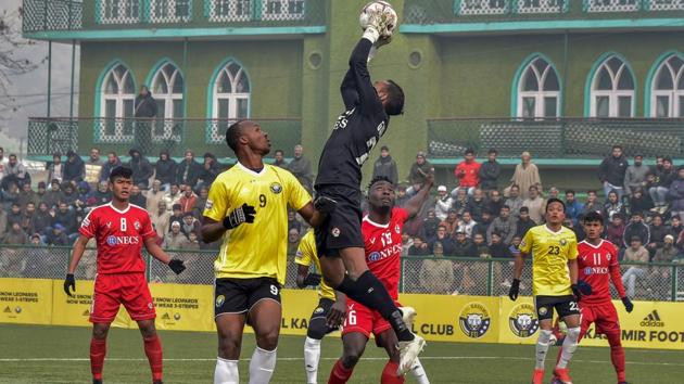 Players of Real Kashmir FC (in yellow) and Aizawl FC in action during their I-League football match in Srinagar.(PTI)