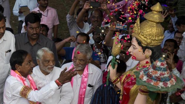 Telangana Rashtra Samithi (TRS) President and Chief Minister of the state K. Chandrashekar Rao showers flower petals on a statue of Telangana Thalli, mother goddess of Telangana, after the party's victory in the state assembly elections in Hyderabad, Telangana. (Mahesh Kumar A. / AP) Telangana Rashtra Samithi (TRS) President and Chief Minister of the state K. Chandrashekar Rao showers flower petals on a statue of Telangana Thalli, mother goddess of Telangana, after the party's victory in the state assembly elections in Hyderabad, Telangana. (Mahesh Kumar A. / AP)