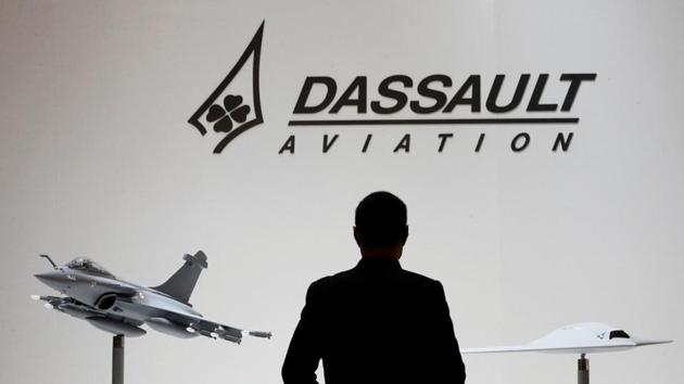 A visitor looks at replicas of the fighter jet Rafale (L) and Neuron on the Dassault booth during the European Business Aviation Convention & Exhibition (EBACE) at Cointrin airport in Geneva, Switzerland, in this picture taken on May 19.(REUTERS) A visitor looks at replicas of the fighter jet Rafale (L) and Neuron on the Dassault booth during the European Business Aviation Convention & Exhibition (EBACE) at Cointrin airport in Geneva, Switzerland, in this picture taken on May 19.(REUTERS)
