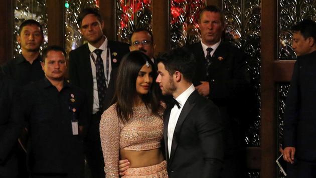 Actor Priyanka Chopra and her husband Nick Jonas arrive to attend the wedding ceremony of Isha Ambani.(REUTERS)