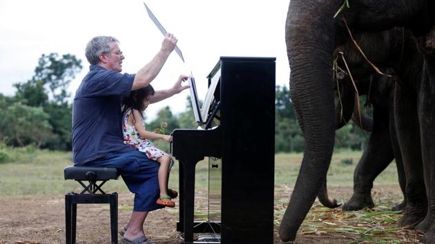 Barton is joined on the piano by his four-year-old daughter Emily. “Maybe some of these blind elephants get a little bit of comfort from hearing pieces of soothing classical music occasionally,” said Barton, who studied at London’s Royal Academy of Arts. (Soe Zeya Tun / REUTERS) Barton is joined on the piano by his four-year-old daughter Emily. “Maybe some of these blind elephants get a little bit of comfort from hearing pieces of soothing classical music occasionally,” said Barton, who studied at London’s Royal Academy of Arts. (Soe Zeya Tun / REUTERS)