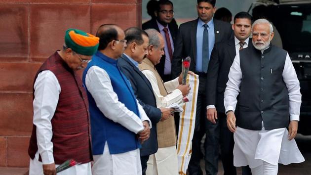 Prime Minister Narendra Modi walks to speak with the media after arriving at the Parliament on the first day of the winter session in New Delhi. (Adnan Abidi / REUTERS) Prime Minister Narendra Modi walks to speak with the media after arriving at the Parliament on the first day of the winter session in New Delhi. (Adnan Abidi / REUTERS)