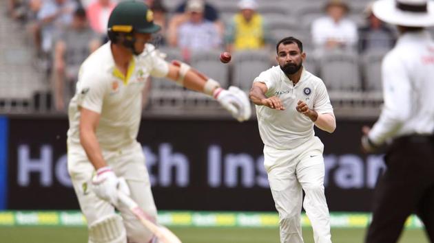 India's Mohammed Shami (C) attempts to run out Australian batsman Pat Cummins (L). (AFP) India's Mohammed Shami (C) attempts to run out Australian batsman Pat Cummins (L). (AFP)