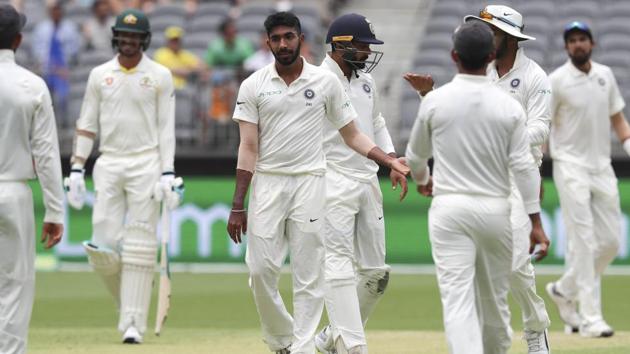 India's Jasprit Bumrah (3rd left) is congratulated by teammates after bowling Australia's Tim Paine. (AP) India's Jasprit Bumrah (3rd left) is congratulated by teammates after bowling Australia's Tim Paine. (AP)
