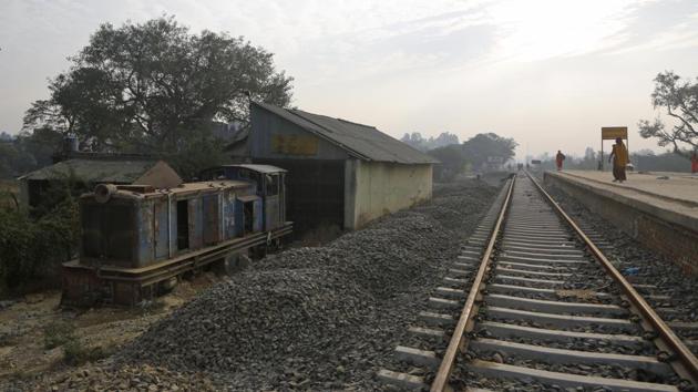An old train engine is seen next to the newly built train tracks between Janakpur in Nepal and Jaynagar. Once the new rail line begins operations, plans call for extending the railway deeper into Nepal. For now, only a dusty trail passing through villages connects Jaynagar and Janakpur. It’s mostly used by people bringing in daily goods on motorcycles and small trucks. (Niranjan Shrestha / AP) 