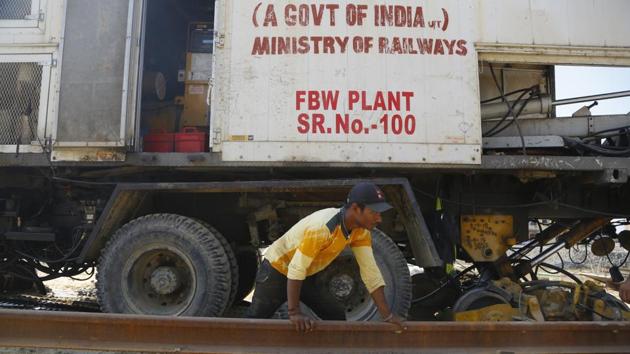 A Nepalese worker busy at Jaynagar station in India. Despite great hopes among those awaiting the new train it’s unclear exactly when passenger service will start. Prime Minister Narendra Modi had been expected to travel by train to Janakpur in December to inaugurate the new line but that plan has been cancelled. (Niranjan Shrestha / AP) 