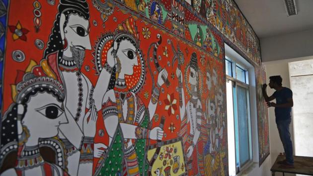 An Indian artist paints a wall with traditional Mithila art at the Janakpur station. India traditionally has had major influence in Nepal economically, socially and culturally. It was instrumental in helping Nepal establish democracy in 1950 and bring it back in 1990, when a popular uprising forced the king to give up power and bring in a multiparty system. But Nepal’s communist party won control in elections last year. (Niranjan Shrestha / AP) 